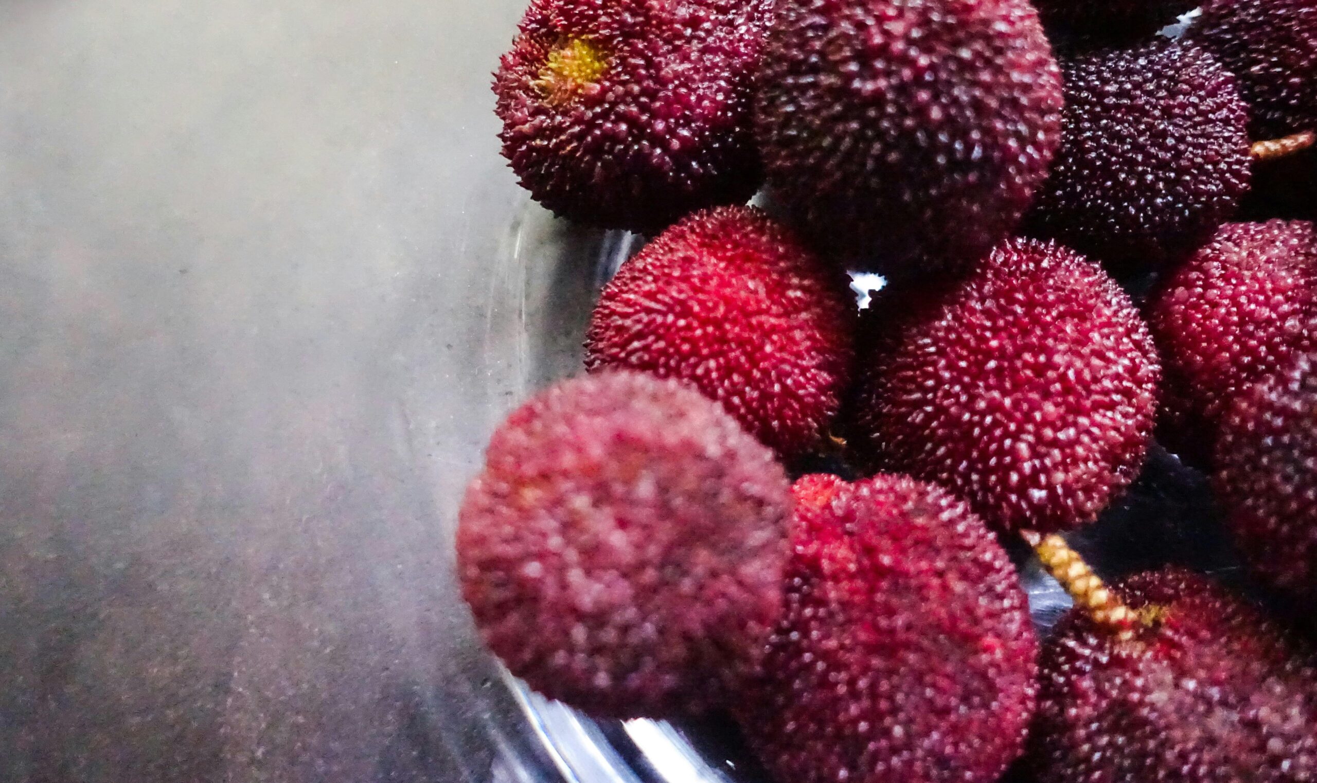 Close-up of fresh fruits rich in vitamins next to glowing skin illustration