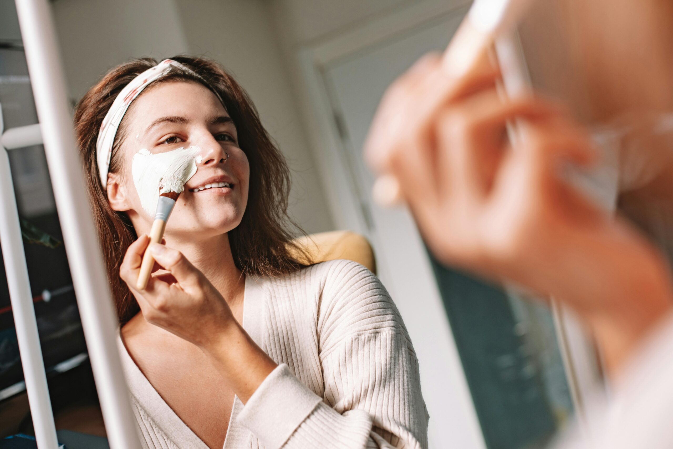 Woman applying an organic seaweed mask at home