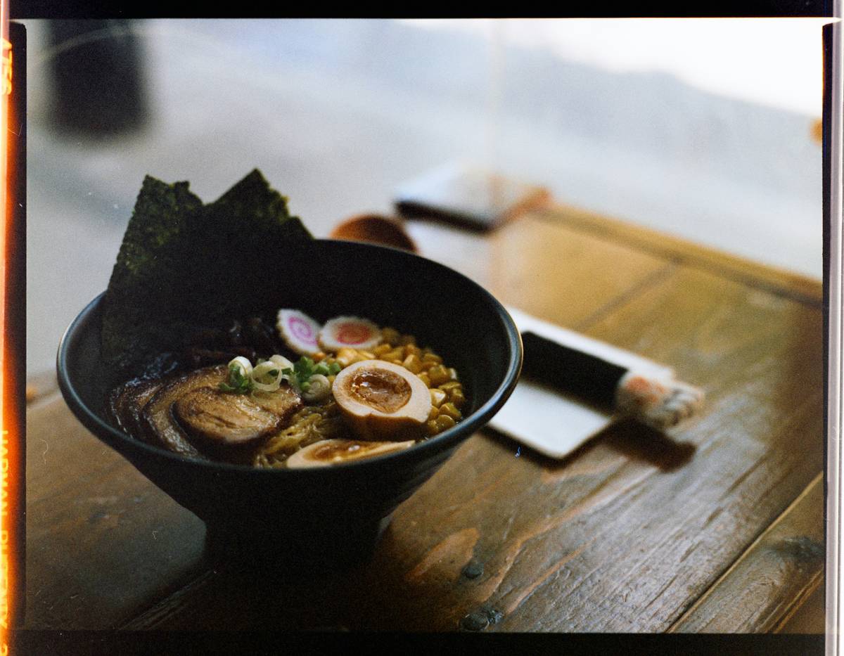 Freshly harvested dulse seaweed in a wooden bowl.