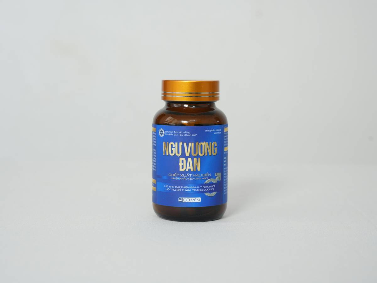 Spirulina tablet displayed with fresh organic ingredients nearby