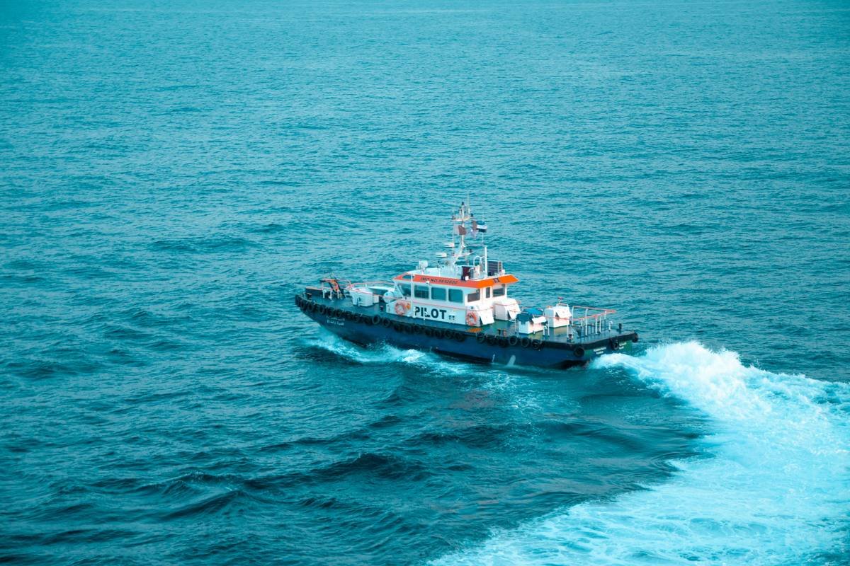 a small boat in the middle of the ocean