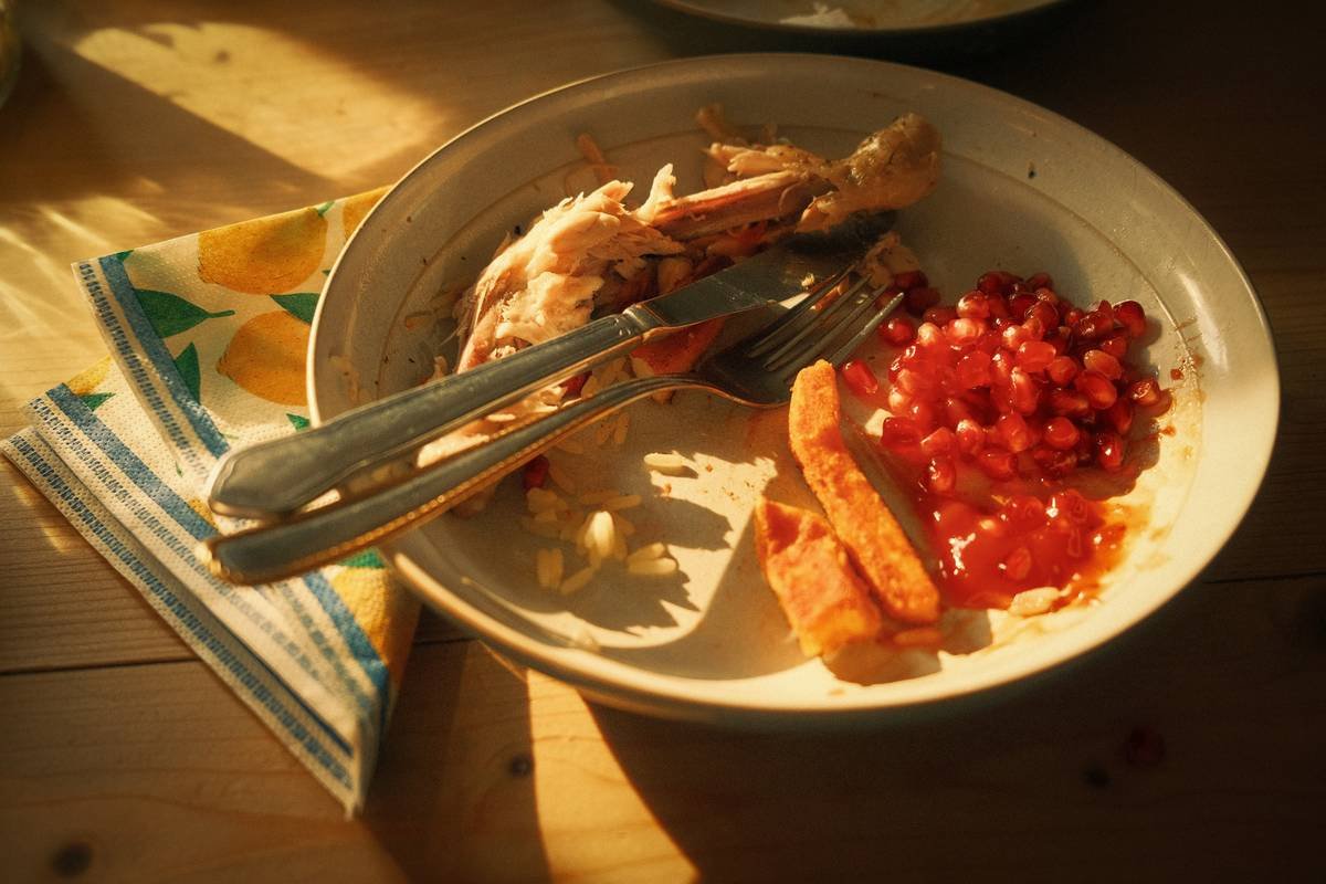 Eaten plate of food at the dinner table